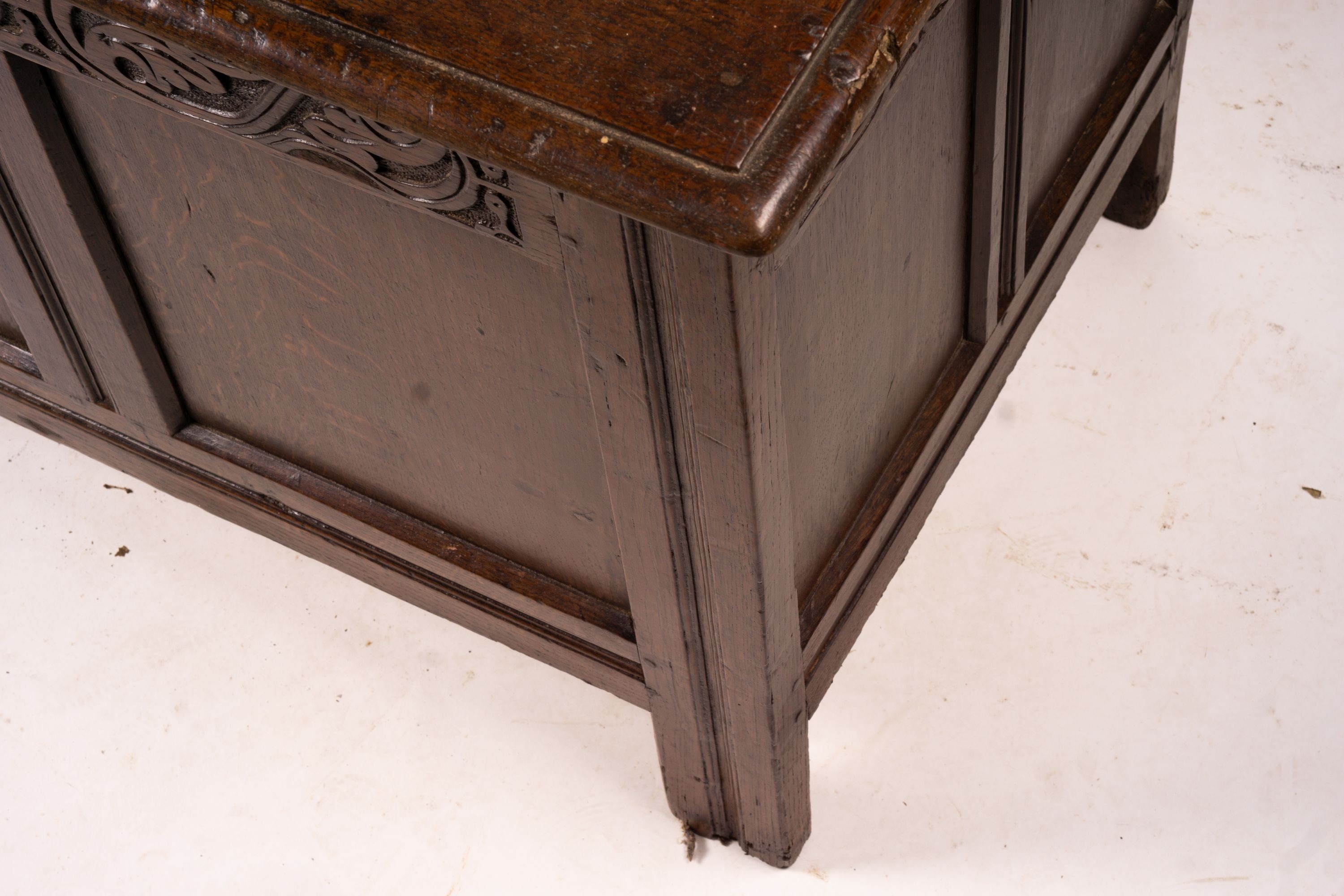 A 17th century panelled oak coffer, W.122cm D.55cm H.65cm